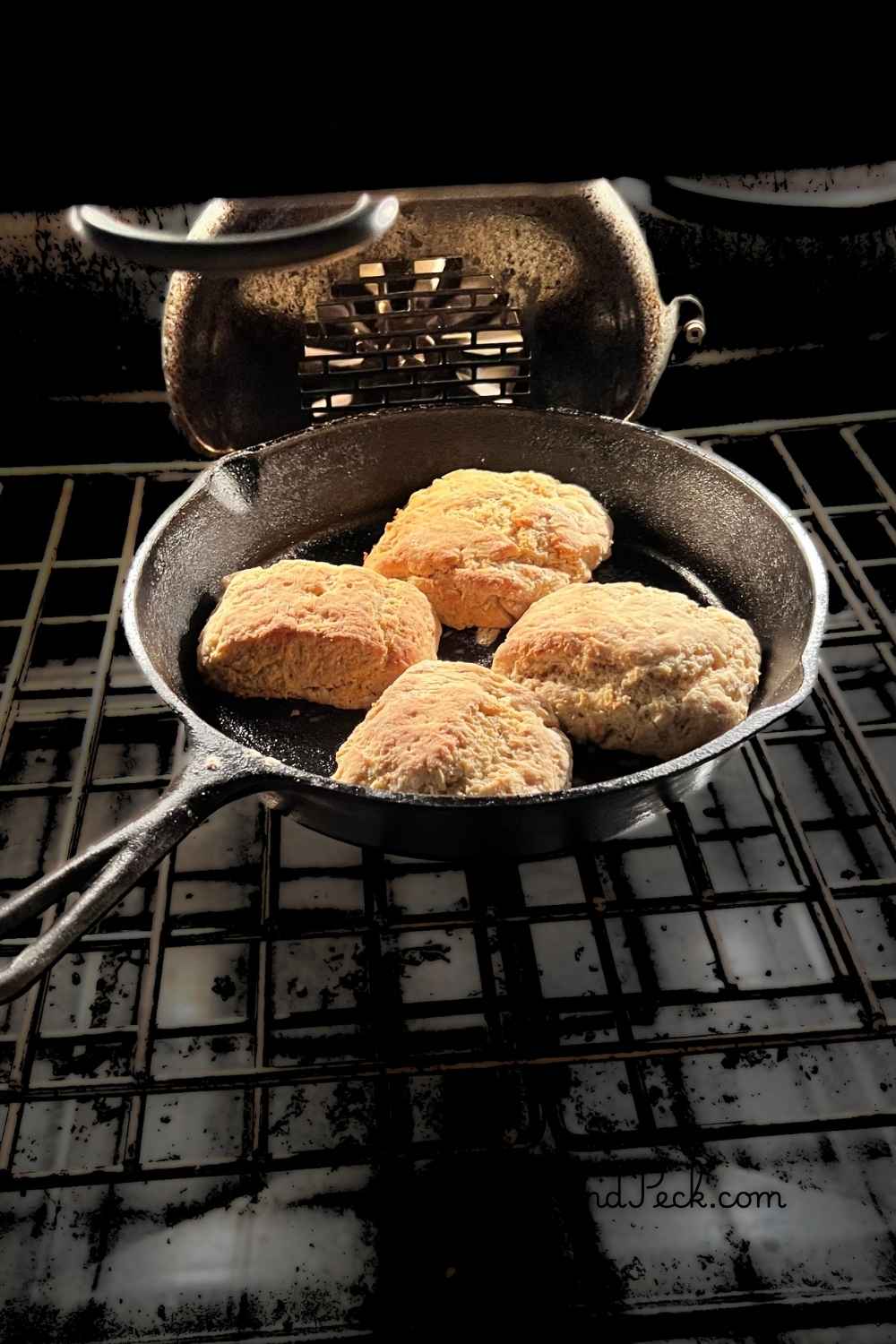 4 sourdough discard biscuits fresh baked in a Kentucky homestead cast iron pan